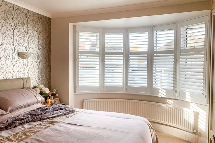 Bedroom bay window plantation shutters